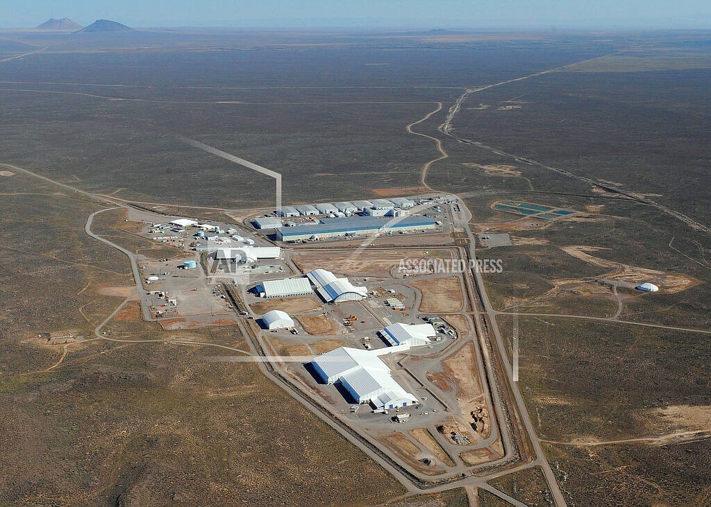 This 2014 aerial photo provided by Idaho Environmental Coalition shows the U.S. Department of Energy's 890-square-mile Radioactive Waste Management Complex site in eastern Idaho. The complex includes the Accelerated Retrieval Project facilities in the foreground and the Advanced Mixed Waste Treatment Project in the background. U.S. officials say they have almost completed a roughly 20-year project to dig up and remove radioactive and hazardous waste buried for decades in unlined pits at a nuclear facility that sits atop a giant aquifer in Idaho Falls in eastern Idaho. (Idaho Environmental Coalition/U.S. Department of Energy via AP)