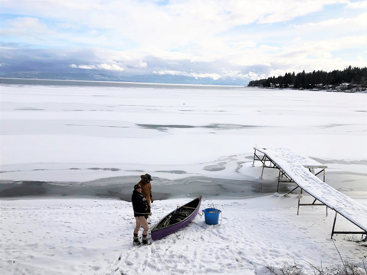 Montana Fish, Wildlife and Parks staff received a report on December 30 of a lethargic trumpeter swan that had not moved for a few days on the ice near Somers Bay on Flathead Lake. FWP staff Jessy Coltrane and Wendy Cole responded with a canoe, lifejacket, and lots of rope.