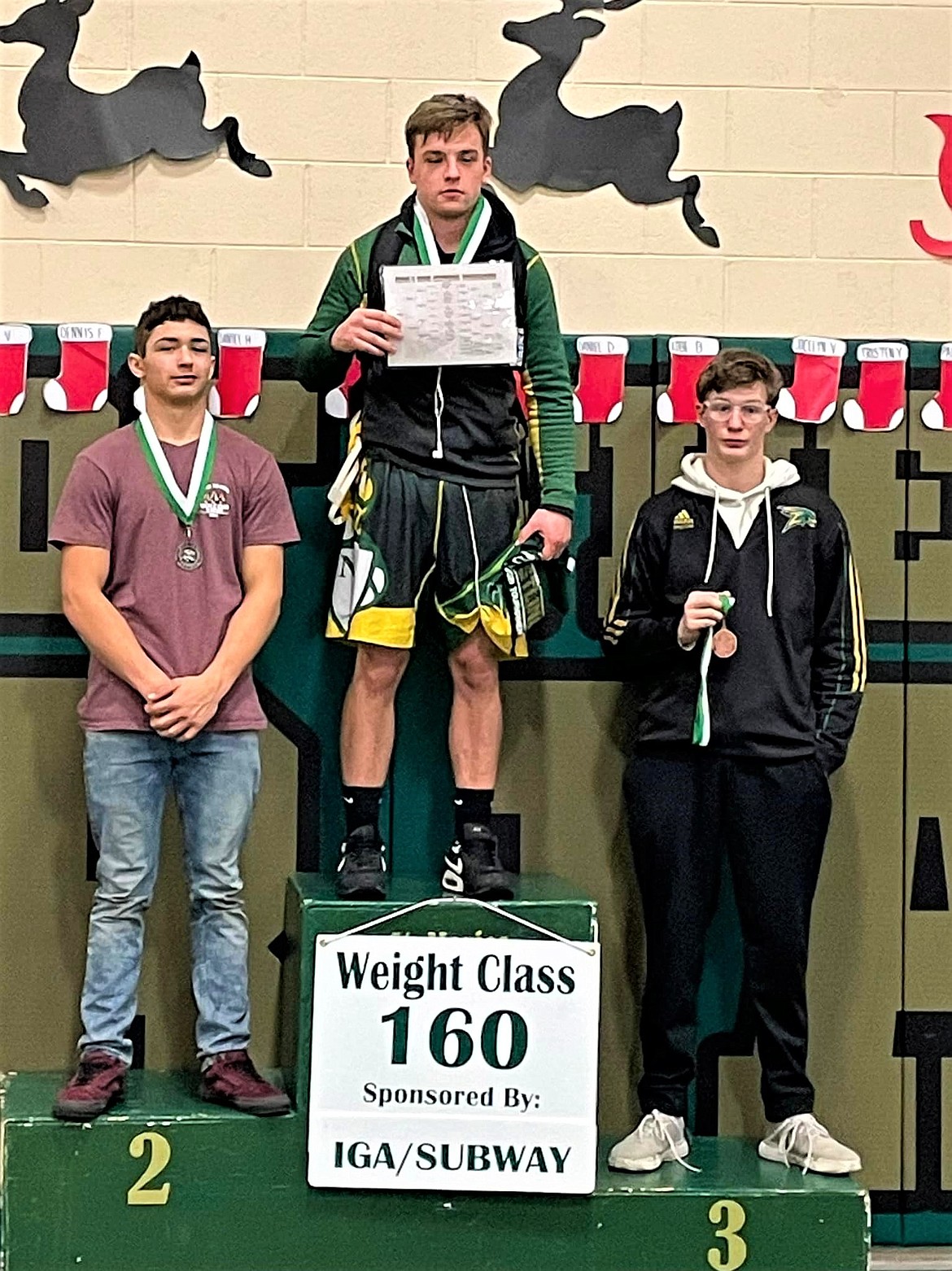 (left) Danny Zech came in second for the 160 pound weight class at the Chad E. Ross wrestling tournament Dec. 30 at St. Maries.