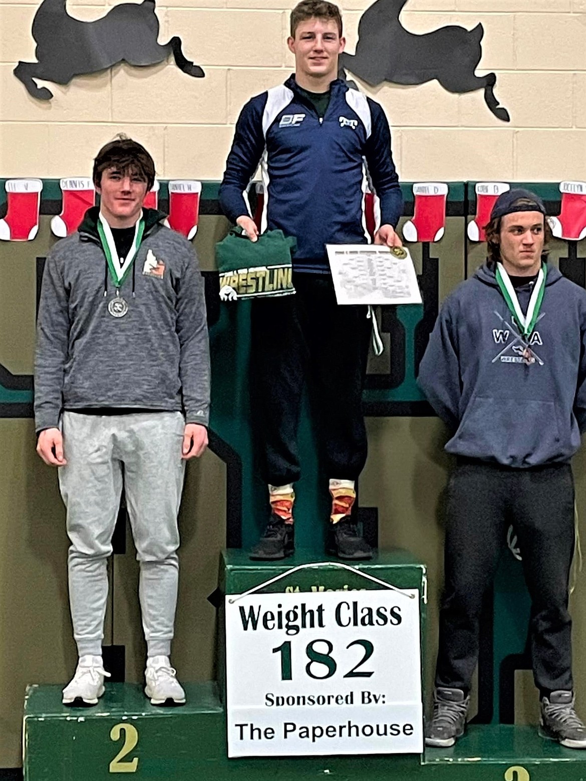 (center) Eli Richards came in first for the 182 pounds weight class at the Chad E. Ross wrestling tournament at St. Maries Dec. 20. Richards was awarded the outstanding wrestler award for tournament.