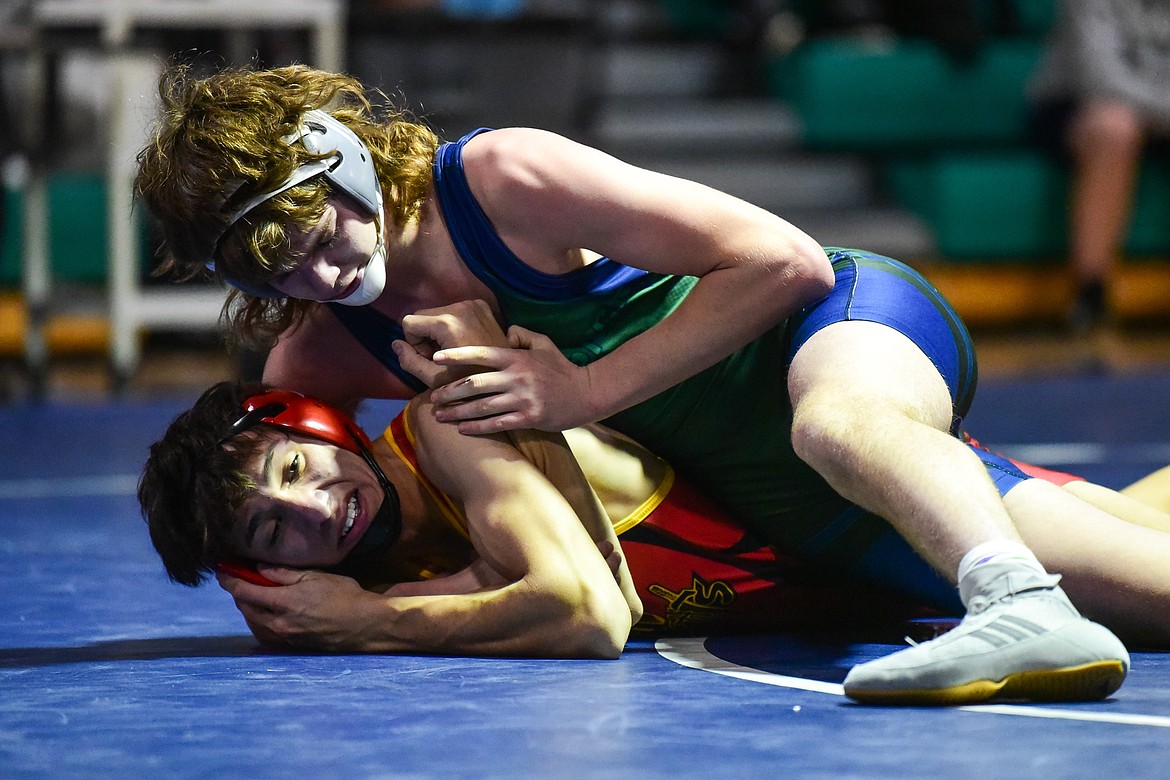 Glacier's Sam Nease wrestles Missoula Hellgate's Zane Nealey at 152 pounds at Glacier High School on Tuesday, Jan. 4. (Casey Kreider/Daily Inter Lake)