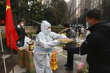 In locked down Chinese city, some complain food hard to get