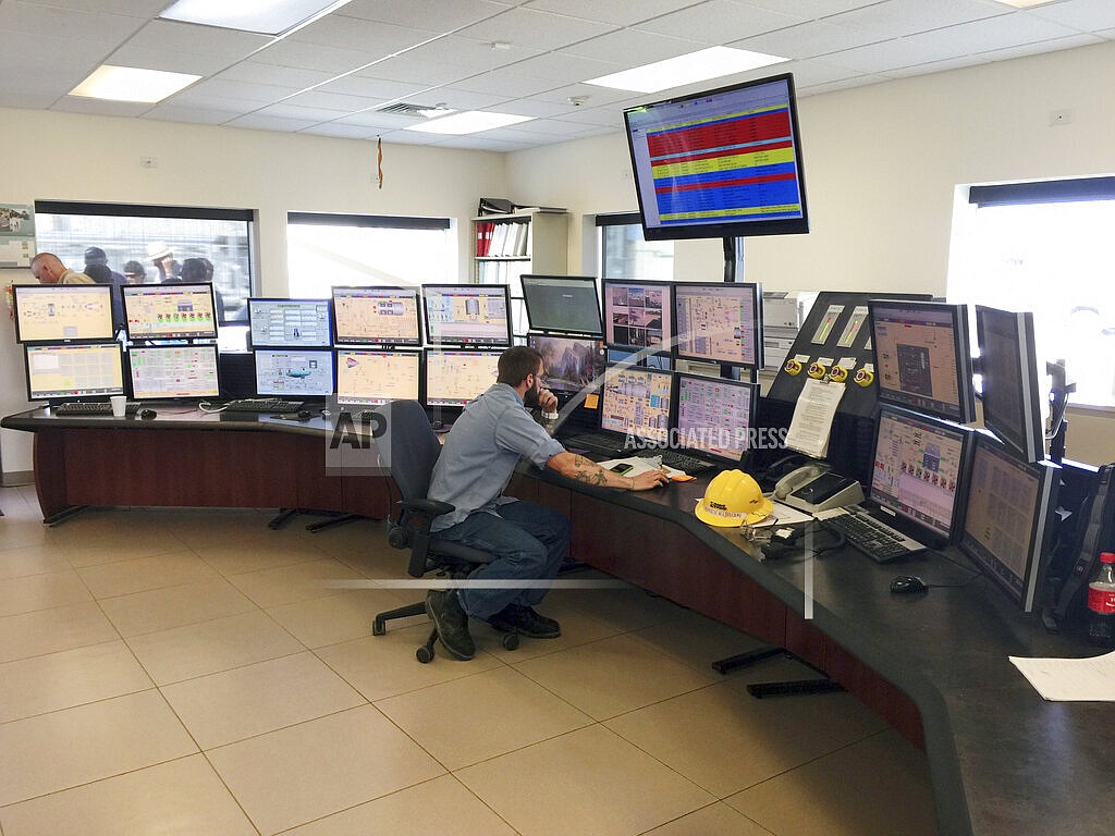 This July 16, 2015 file photo shows employee Michael Kurian at Idaho Power Company's Langley Gulch Power Plant in New Plymouth, Idaho. Idaho Power has submitted a 20-year plan to state regulators that phases out coal-fired power plants by 2028 as part of an effort to provide only clean energy by 2045. The public utility in a news release, Tuesday, Jan. 4, 2022, said it submitted its Integrated Resources Plan to the Idaho Public Utilities Commission. (AP Photo/Keith Ridler, File)