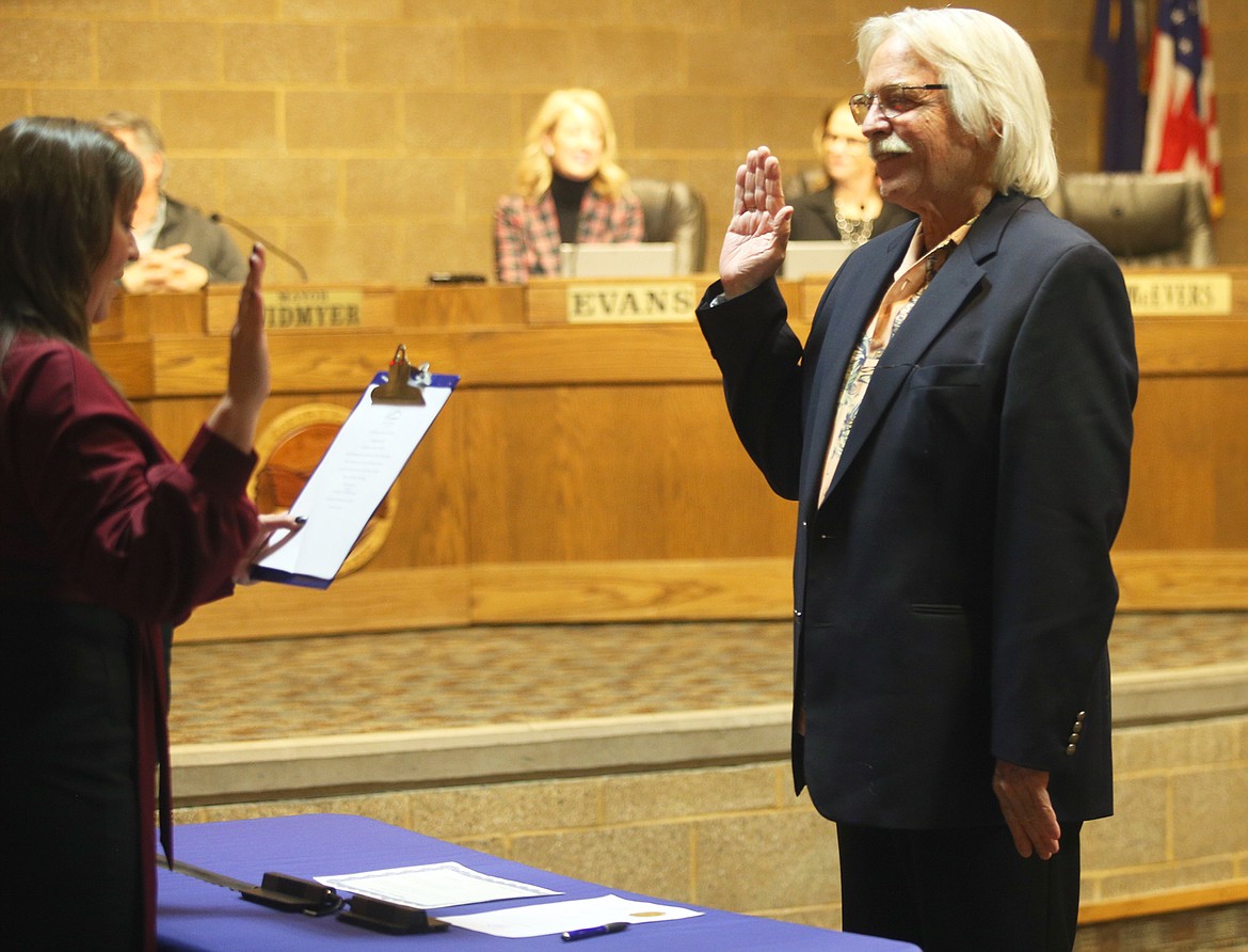 Woody McEvers takes the Oath of Office as a members of the Coeur d'Alene City Council on Tuesday.