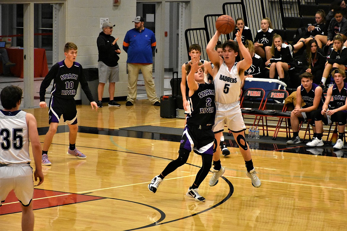 Blake Rice passing the ball against Snake River at the Parma Holiday Classic tournament Dec. 28-30.
