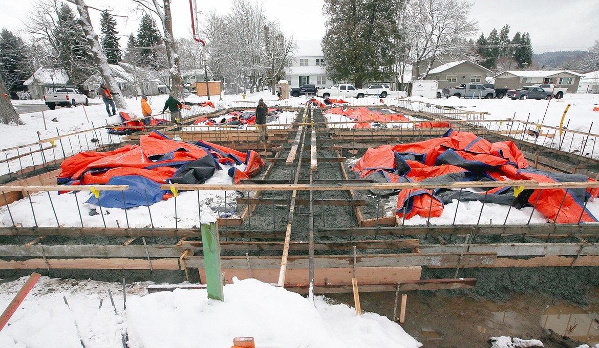 Work continues Wednesday on The Nest on Lakeside, a luxury home project at Eighth and Lakeside by Measom Holdings LLC.