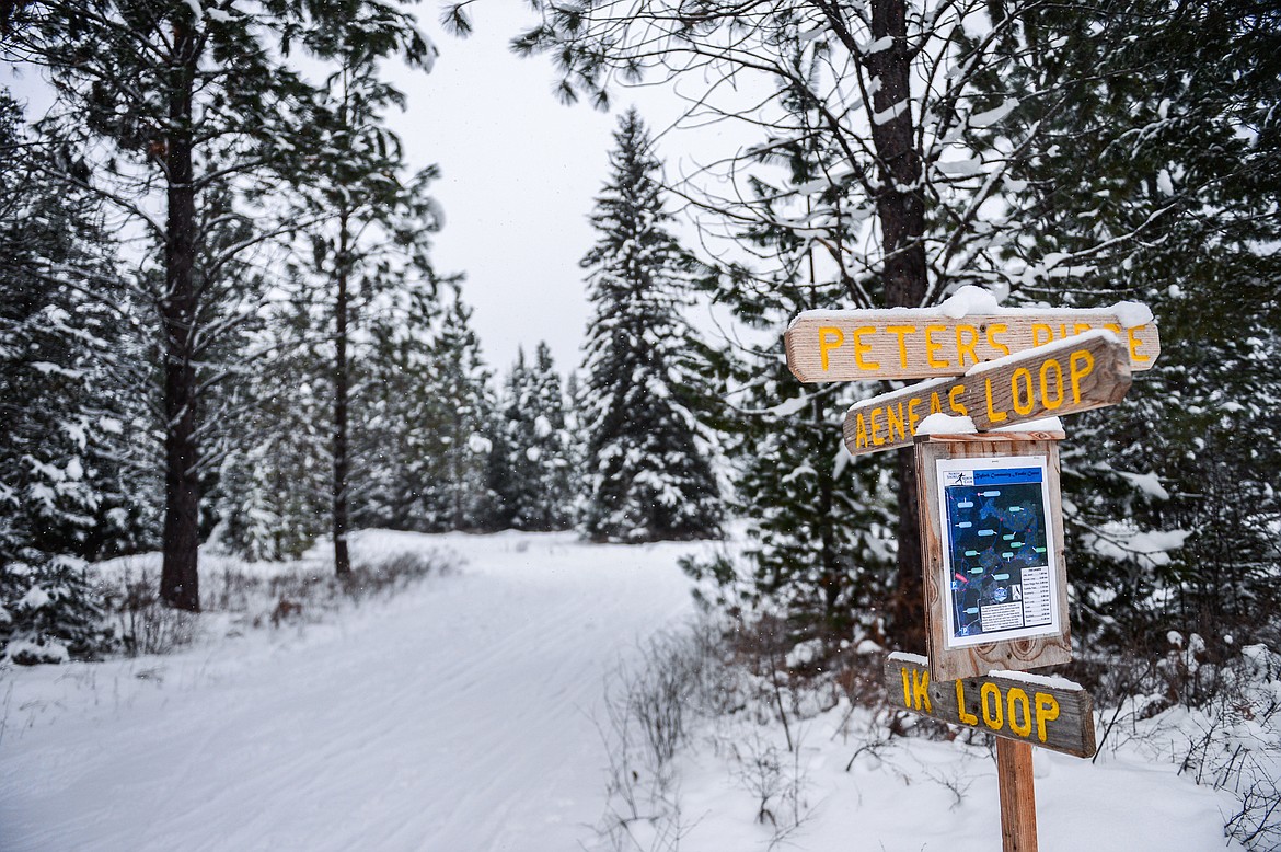 Signage and a trail map at an intersection at the Bigfork Community Nordic Center trails on Foothill Road on Wednesday, Jan. 5. (Casey Kreider/Daily Inter Lake)