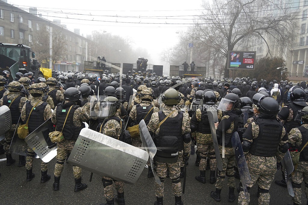 Riot police block a street to prevent demonstrators during a protest in Almaty, Kazakhstan, Wednesday, Jan. 5, 2022. Demonstrators denouncing the doubling of prices for liquefied gas have clashed with police in Kazakhstan's largest city and held protests in about a dozen other cities in the country. (AP Photo/Vladimir Tretyakov)