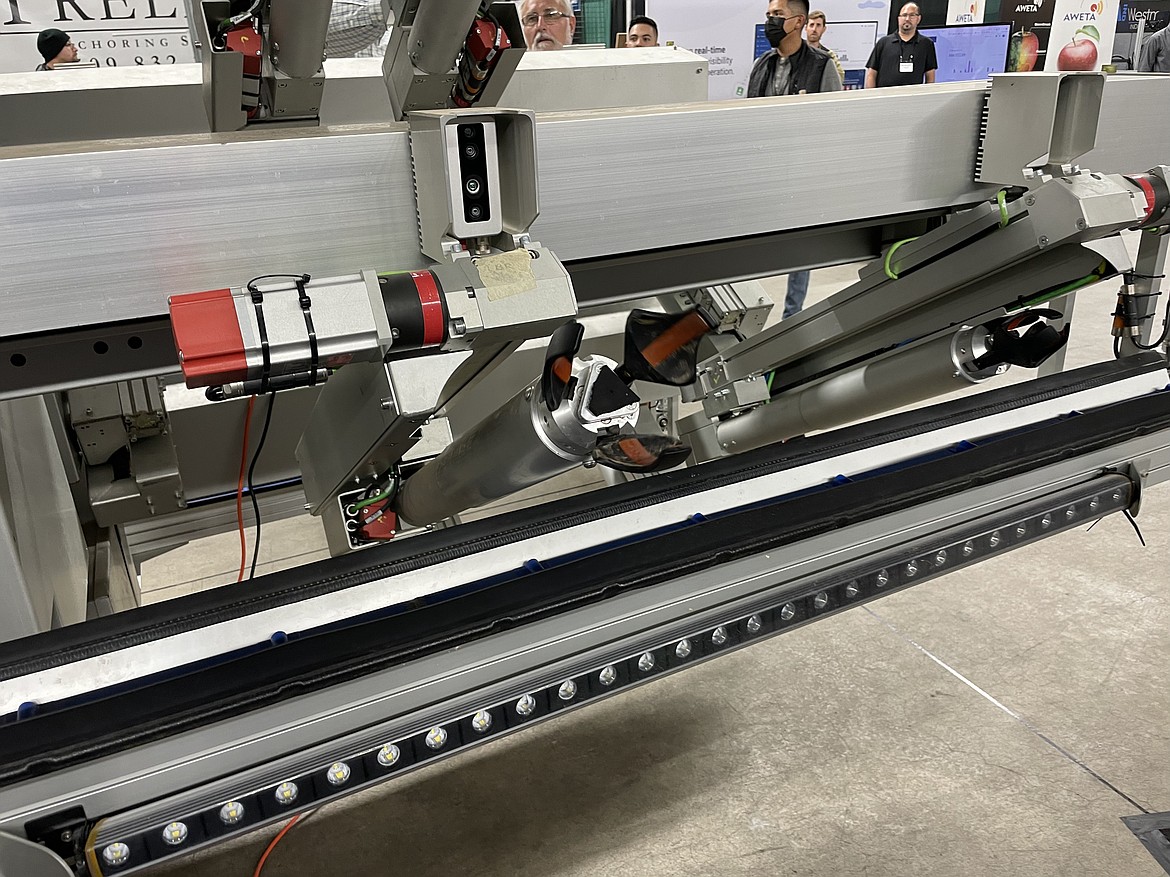 A close-up of FFRobotics’ automated picking machines. Company CEO and co-founder Avi Kahani said the three-pronged gripping hands were redesigned earlier this year to handle fruit better.