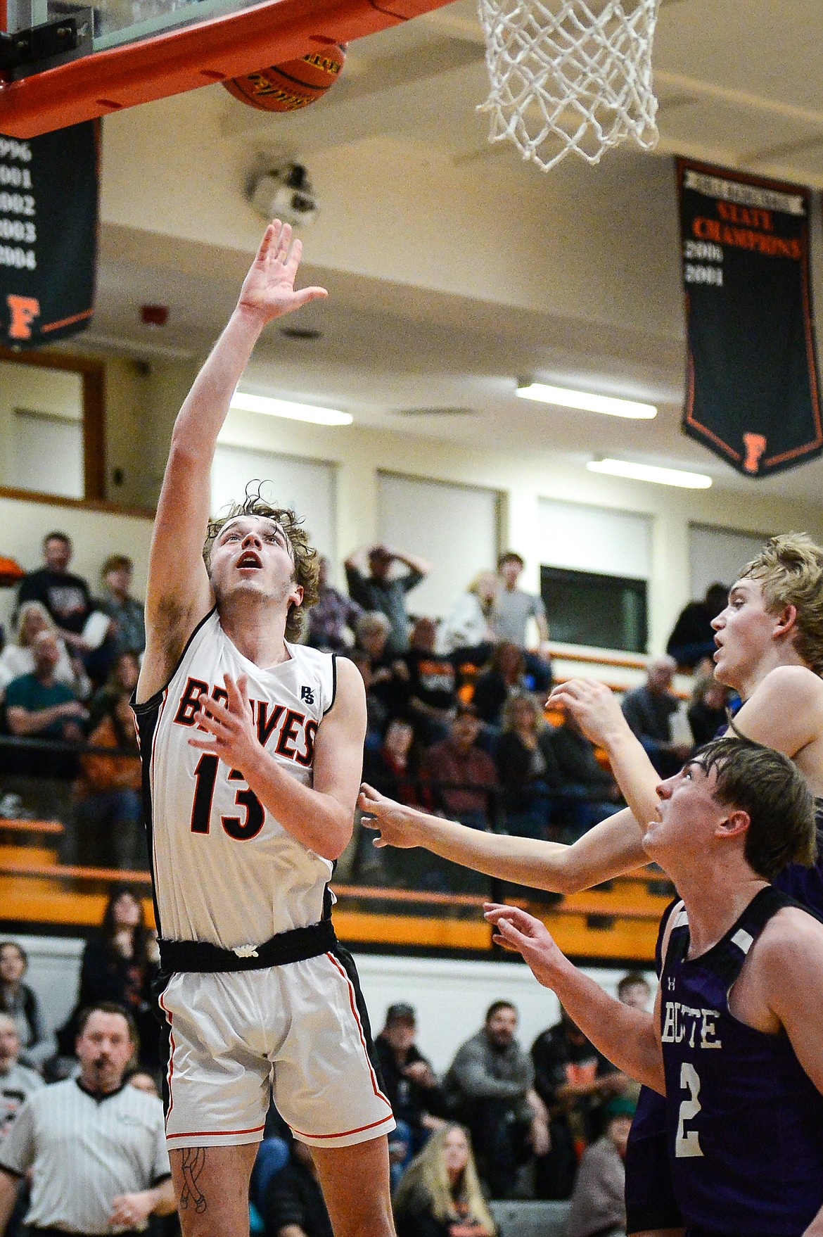 Flathead's Gavin Chouinard (13) goes to the basket against Butte at Flathead High School on Friday, Jan. 7. (Casey Kreider/Daily Inter Lake)