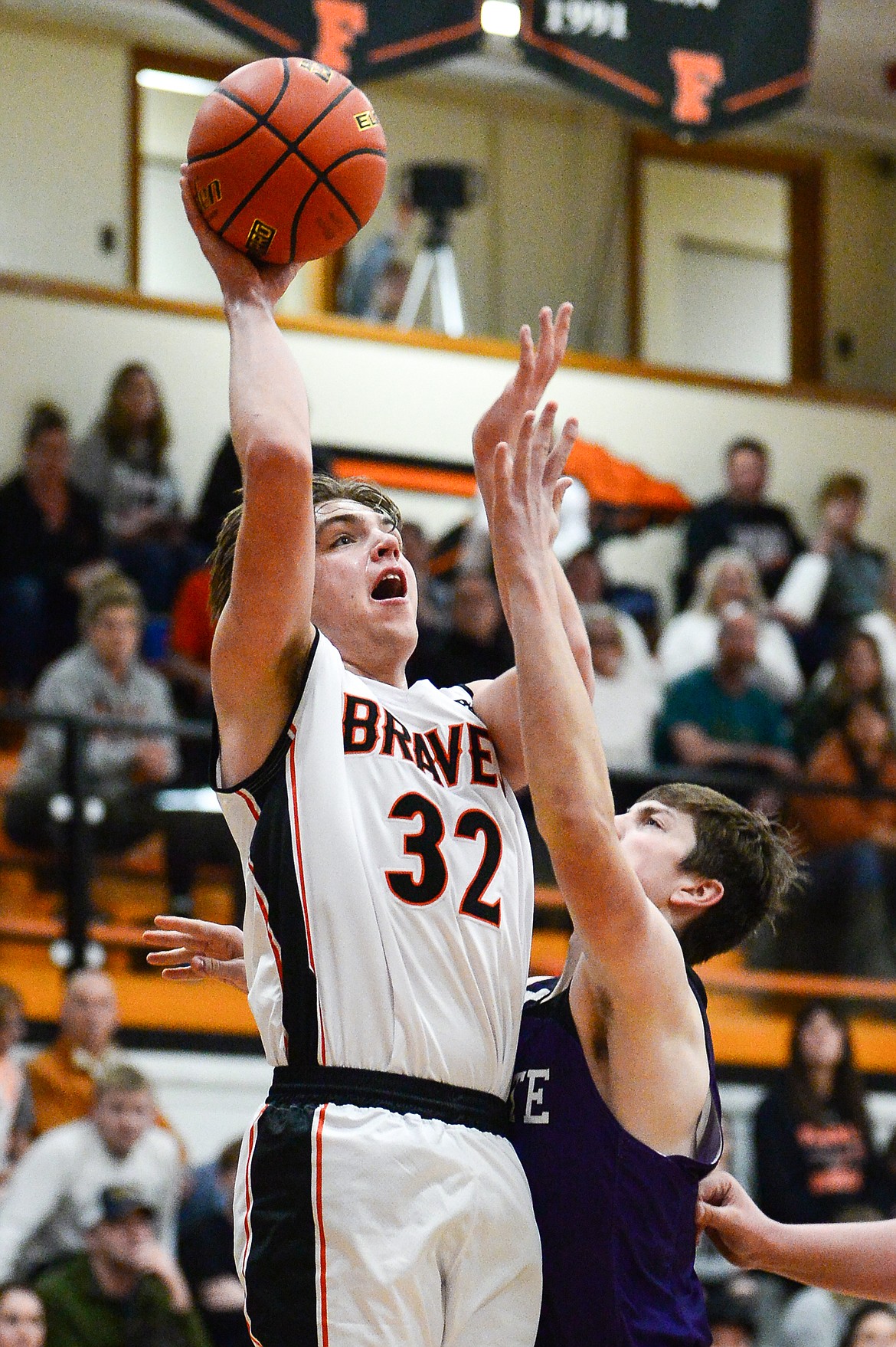 Flathead's Luca Zoeller (32) shoots over Butte's Jonas Sherman (5) at Flathead High School on Friday, Jan. 7. (Casey Kreider/Daily Inter Lake)