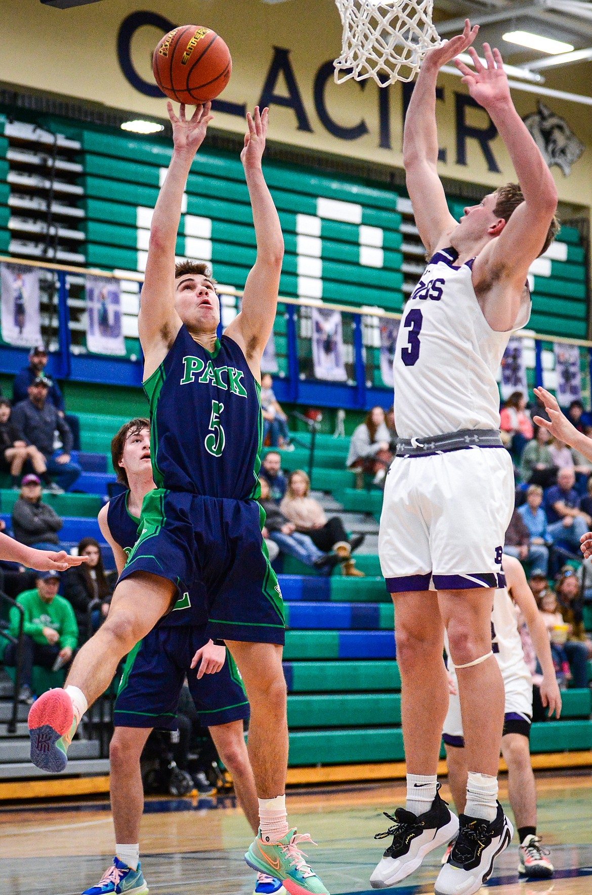 Glacier's Ty Olsen (5) goes to the basket against Butte's Cameron Gurnsey (3) at Glacier High School on Saturday, Jan. 8. (Casey Kreider/Daily Inter Lake)