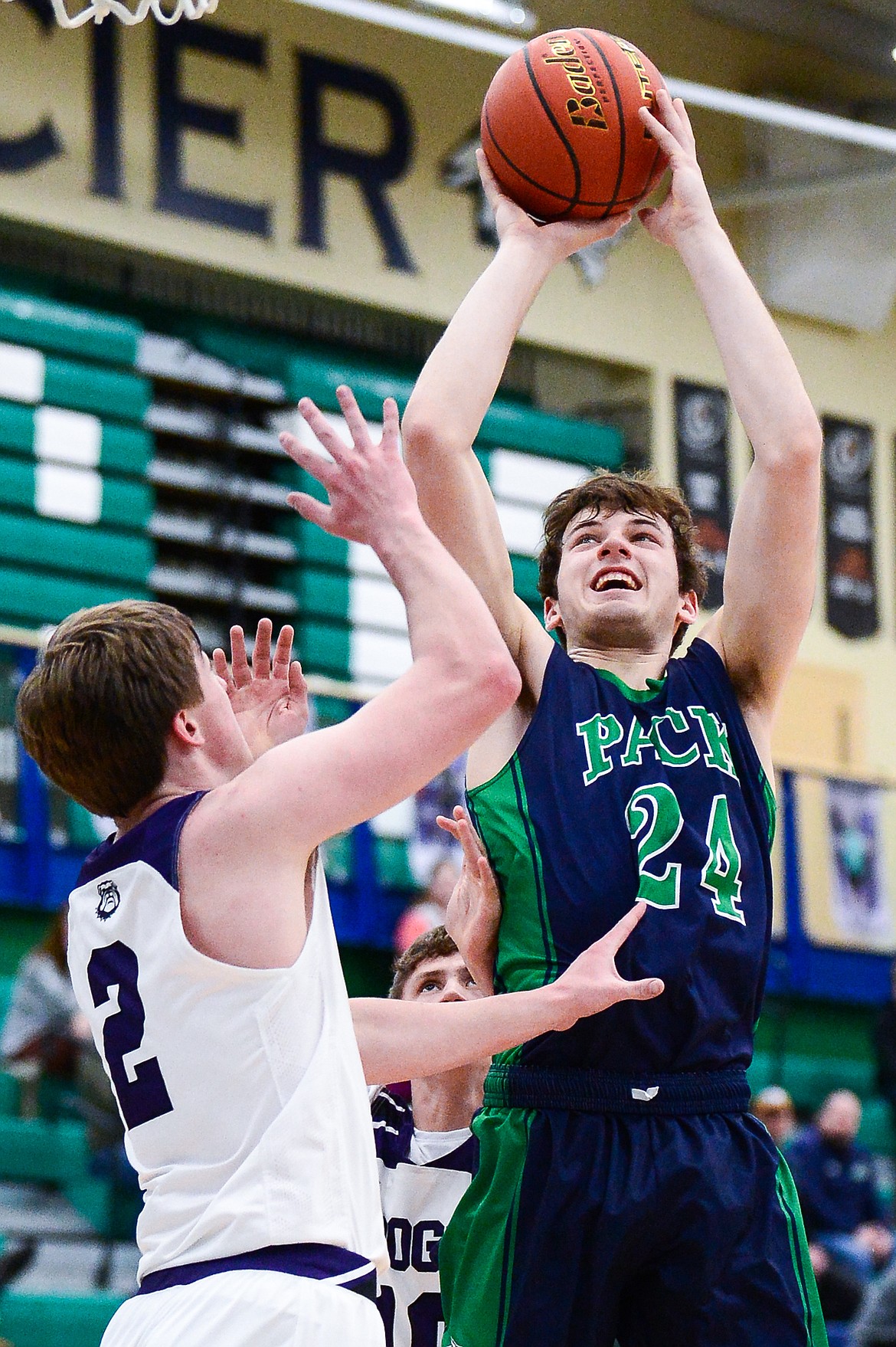 Glacier's Noah Dowler (24) looks to shoot over Butte's Jace Stenson (2) at Glacier High School on Saturday, Jan. 8. (Casey Kreider/Daily Inter Lake)