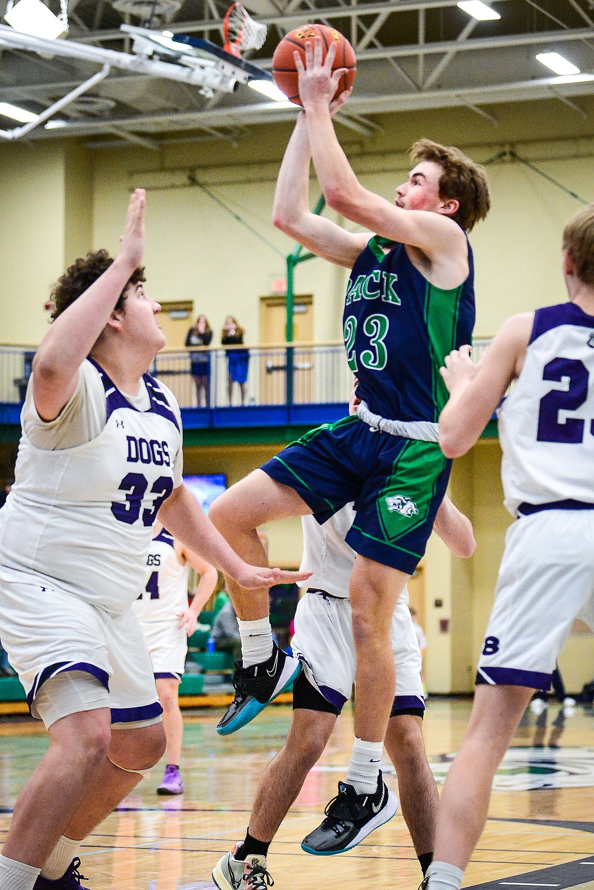 Glacier's Will Salonen (23) looks to shoot in between Butte defenders Kooper Klobucar (33) and Bo Demarais (23) at Glacier High School on Saturday, Jan. 8. (Casey Kreider/Daily Inter Lake)