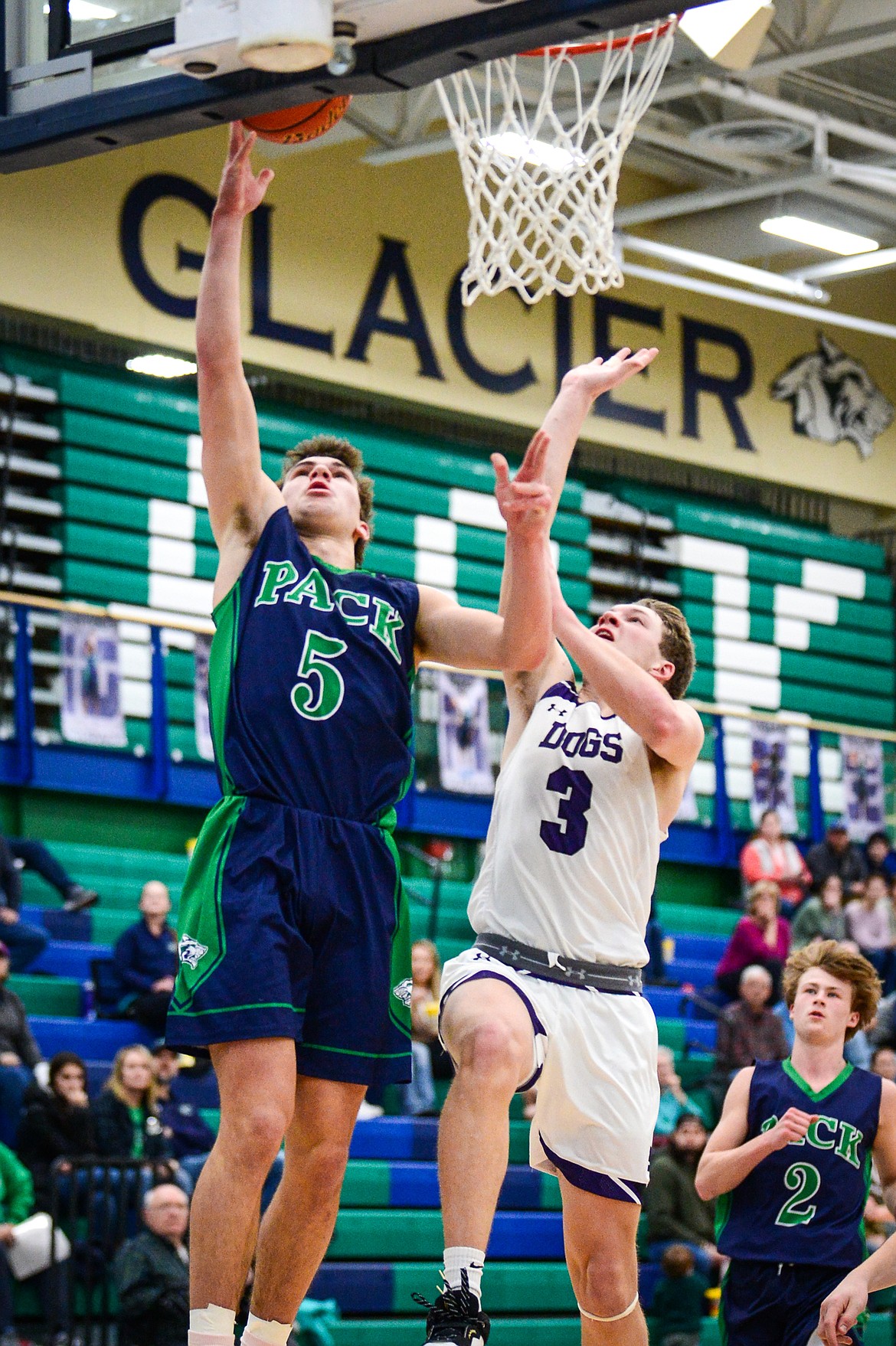 Glacier's Ty Olsen (5) goes to the basket against Butte's Cameron Gurnsey (3) at Glacier High School on Saturday, Jan. 8. (Casey Kreider/Daily Inter Lake)