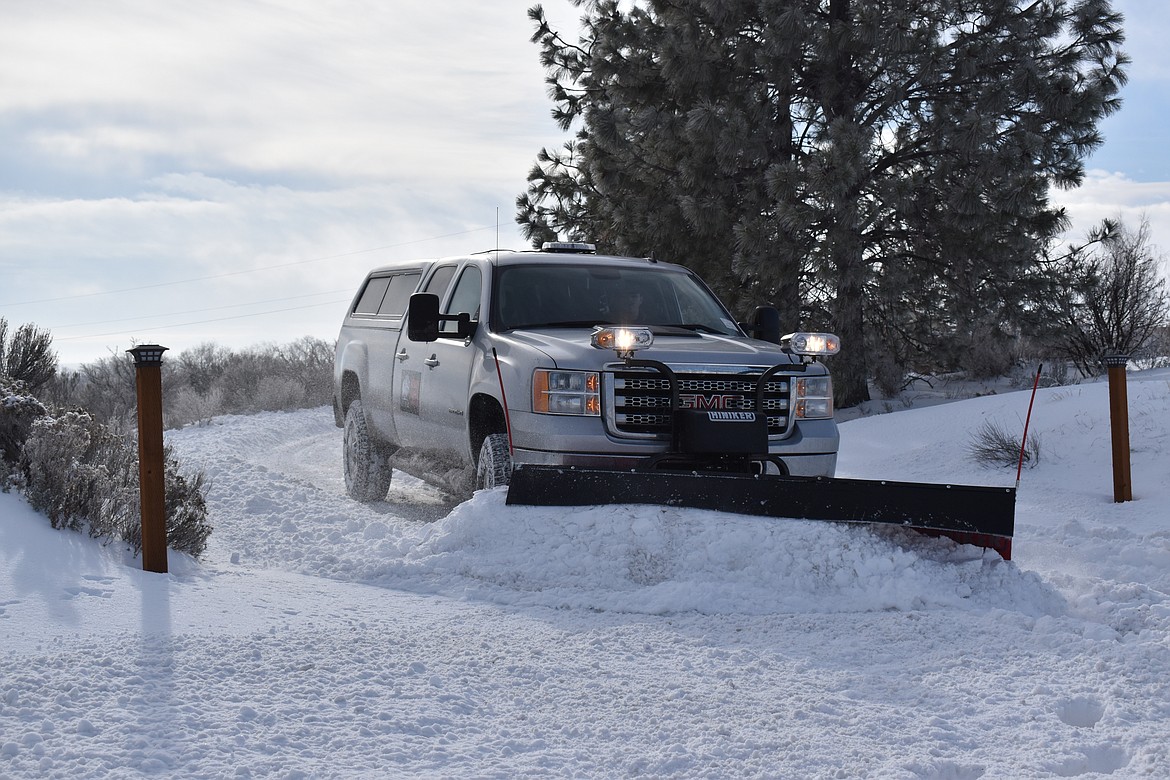 The owner of White Buffalo Drone Services, Jeff Gallaher, plows with his truck recently.