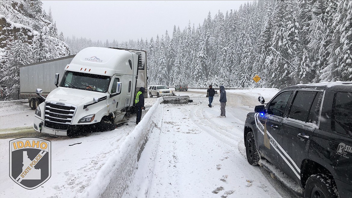 Idaho State Police troopers respond to a crashed semi-truck last Thursday at milepost 26 on Fourth of July Pass that caused a shutdown of the westbound lanes for more than three hours.