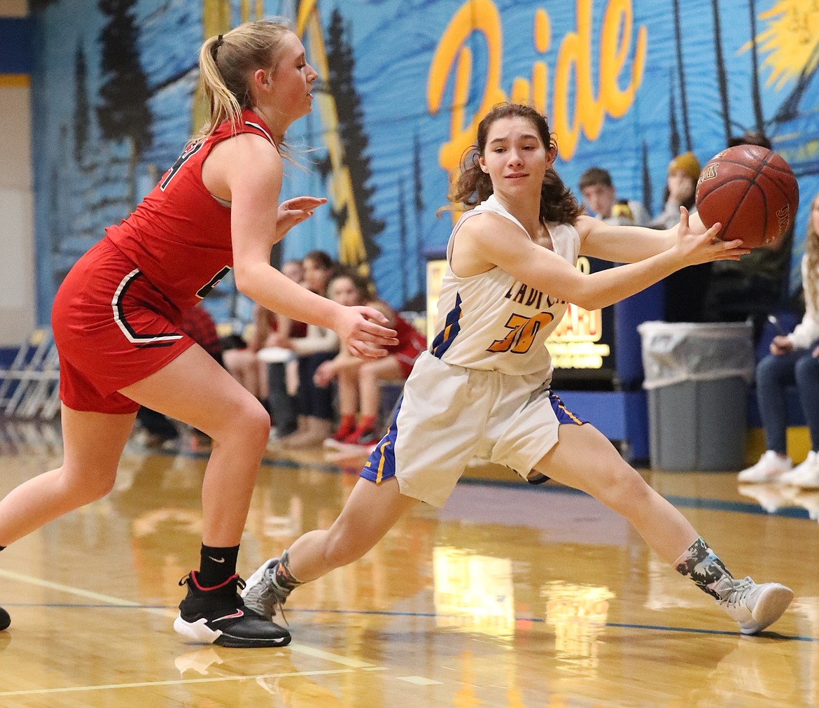 Hannah Thompson looks to pass the ball to a teammate during Tuesday's game.