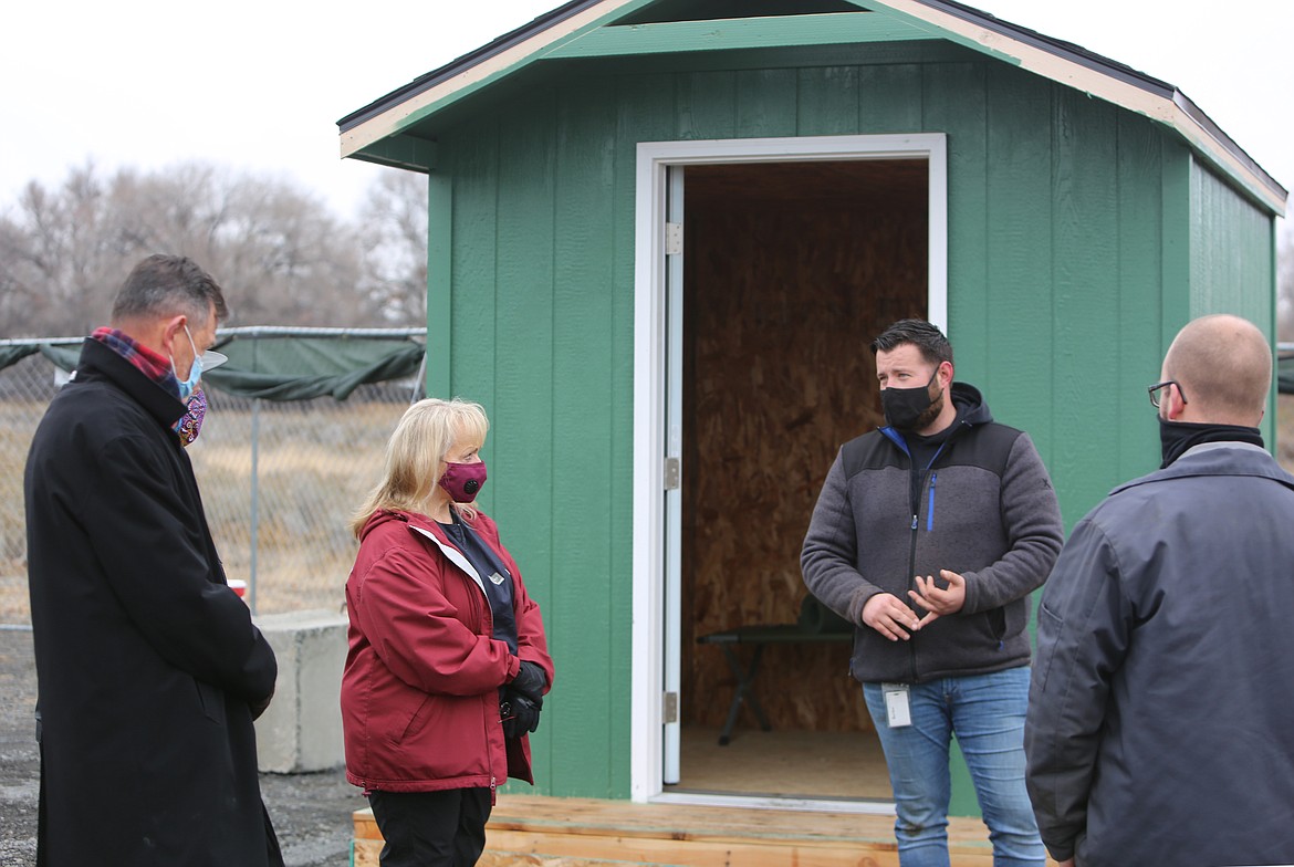 From the left, former Moses Lake Mayor David Curnel, former council member Karen Liebrecht, Housing and Grants Coordinator Taylor Burton and council member Don Myers (with others) meet at the city’s new Sleep Center in December 2020.