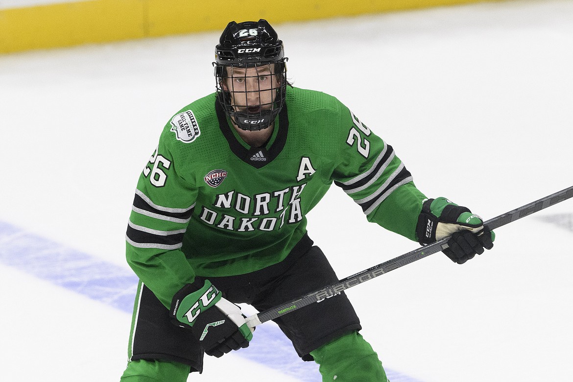 North Dakota defenseman Jake Sanderson plays against Penn State during an NCAA college hockey game on Saturday, Oct. 30, 2021, in Nashville, Tenn.(AP Photo/John Amis, File)