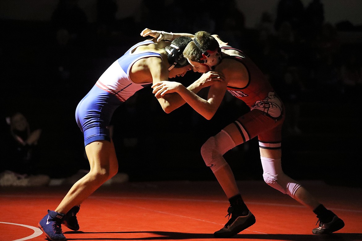 Andrew Duke (right) battles his opponent at 98 pounds Wednesday.