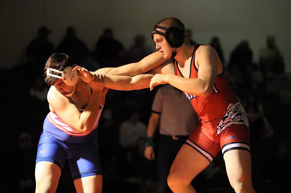 Austin Smith (right) fends off his opponent Wednesday.