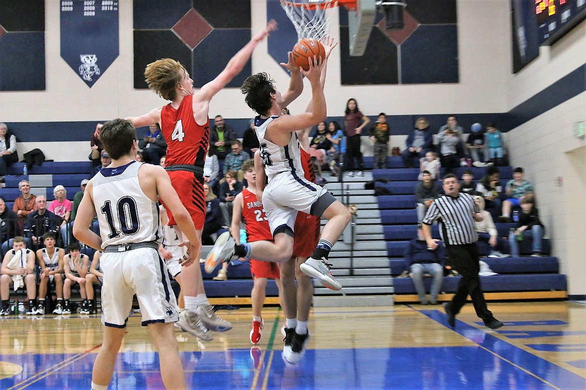 Braeden Blackmore scores a layin against Sandpoint Jan. 11. He scored 15 points had two assists, three steals and six rebounds.