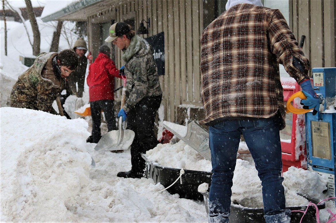 BFHS students and athletes shovel out a local buisness on a snow day.