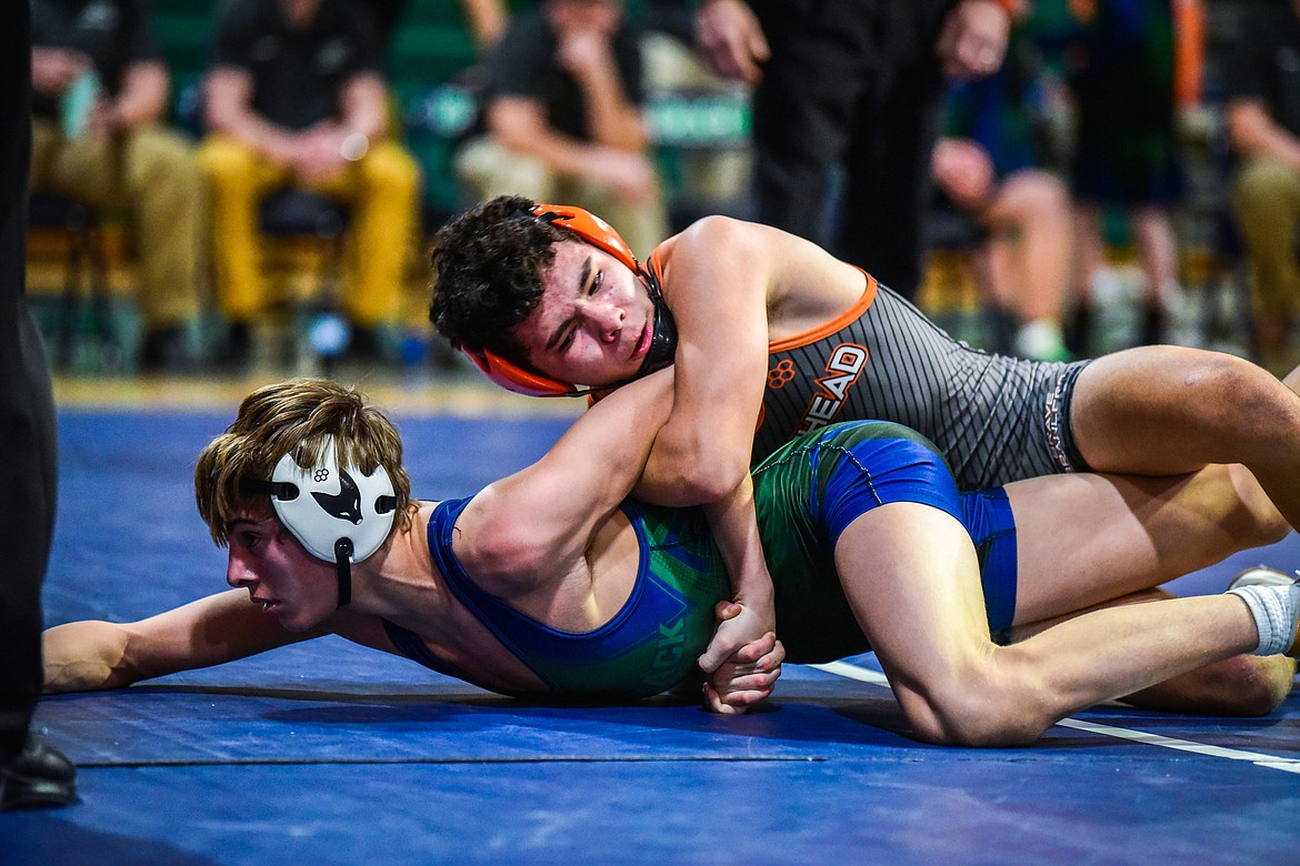 Flathead's Diesel Thompson wrestles Glacier's CJ Johnson at 120 pounds at Glacier High School on Thursday, Jan. 13. (Casey Kreider/Daily Inter Lake)