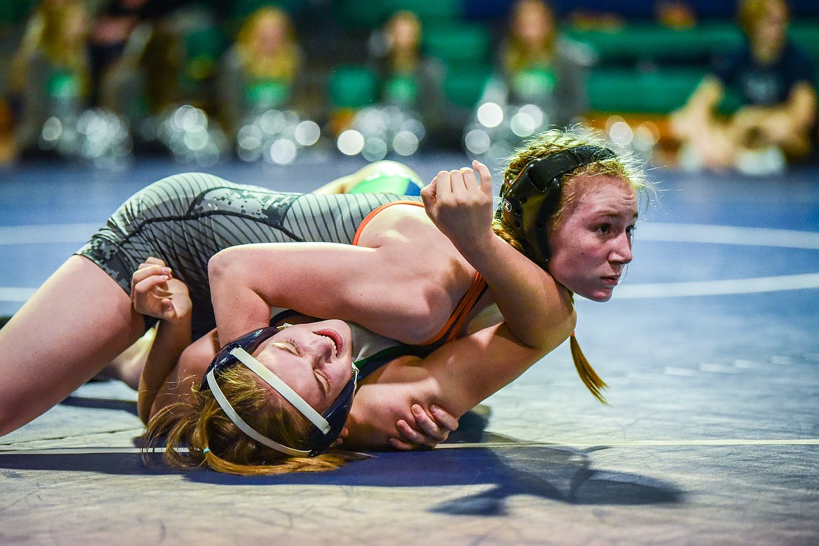 Flathead's Lily McMahon works toward a pin of Glacier's Jessalyn Hewitt at 132 pounds at Glacier High School on Thursday, Jan. 13. (Casey Kreider/Daily Inter Lake)