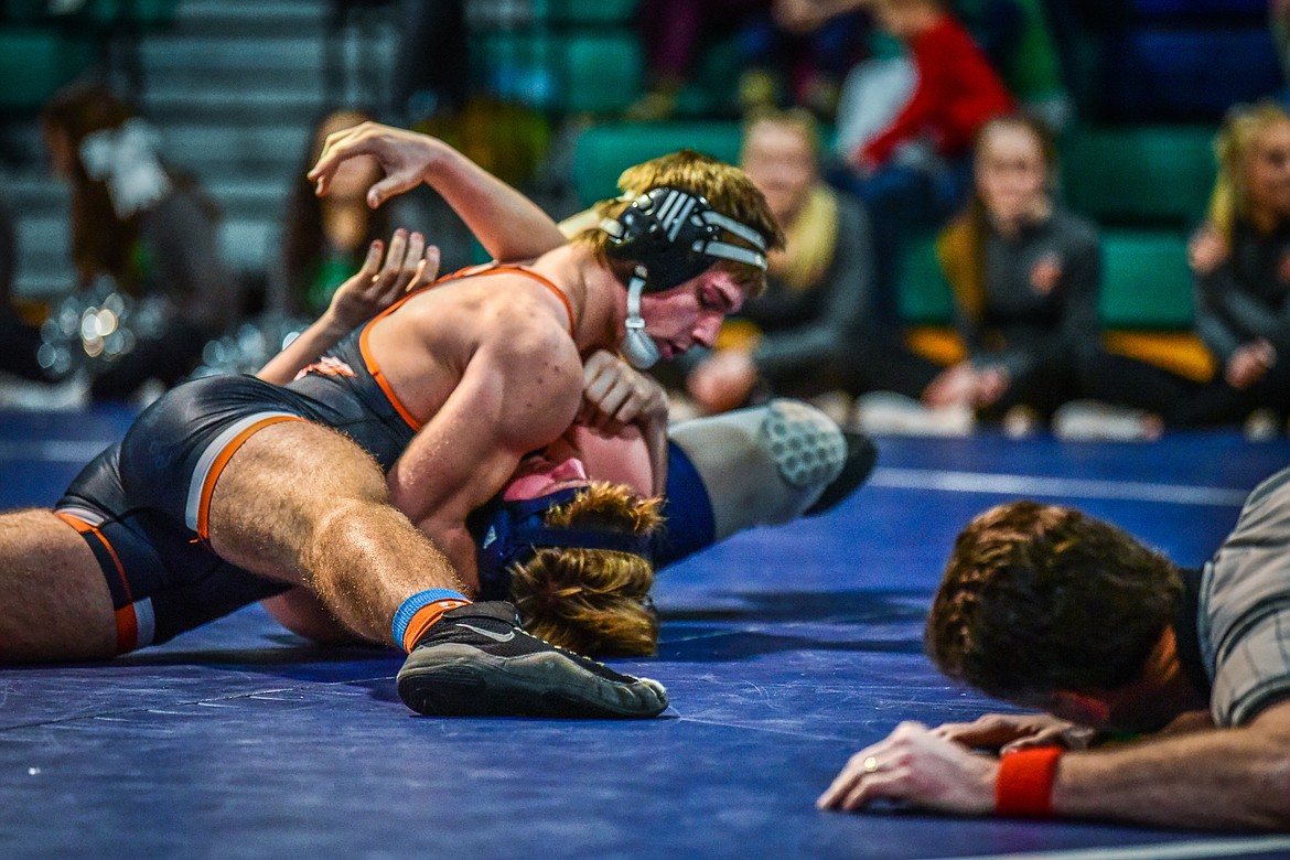 Flathead's Noah Poe-Hatten works toward a pin of Glacier's Colton Vergeront at 205 pounds at Glacier High School on Thursday, Jan. 13. (Casey Kreider/Daily Inter Lake)