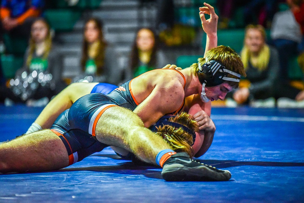 Flathead's Noah Poe-Hatten works toward a pin of Glacier's Colton Vergeront at 205 pounds at Glacier High School on Thursday, Jan. 13. (Casey Kreider/Daily Inter Lake)