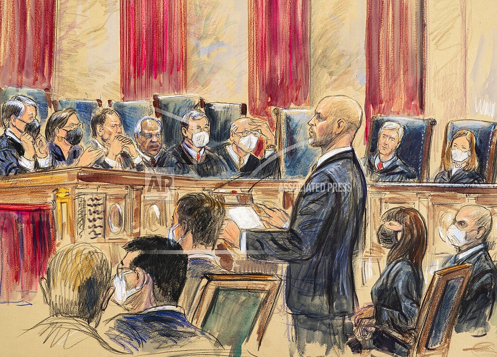 This artist sketch depicts lawyer Scott Keller standing to argue on behalf of more than two dozen business groups seeking an immediate order from the Supreme Court to halt a Biden administration order to impose a vaccine-or-testing requirement on the nation's large employers during the COVID-19 pandemic, at the Supreme Court in Washington, Jan. 7, 2022. The Supreme Court has stopped the Biden administration from enforcing a requirement that employees at large businesses be vaccinated against COVID-19 or undergo weekly testing and wear a mask on the job. The court's order Thursday during a spike in coronavirus cases deals a blow to the administration's efforts to boost the vaccination rate among Americans. (Dana Verkouteren via AP, File)