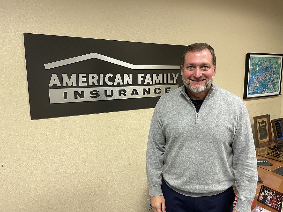 Chris Arnberg, owner of the American Family Insurance agency in Moses Lake, stands in his office.