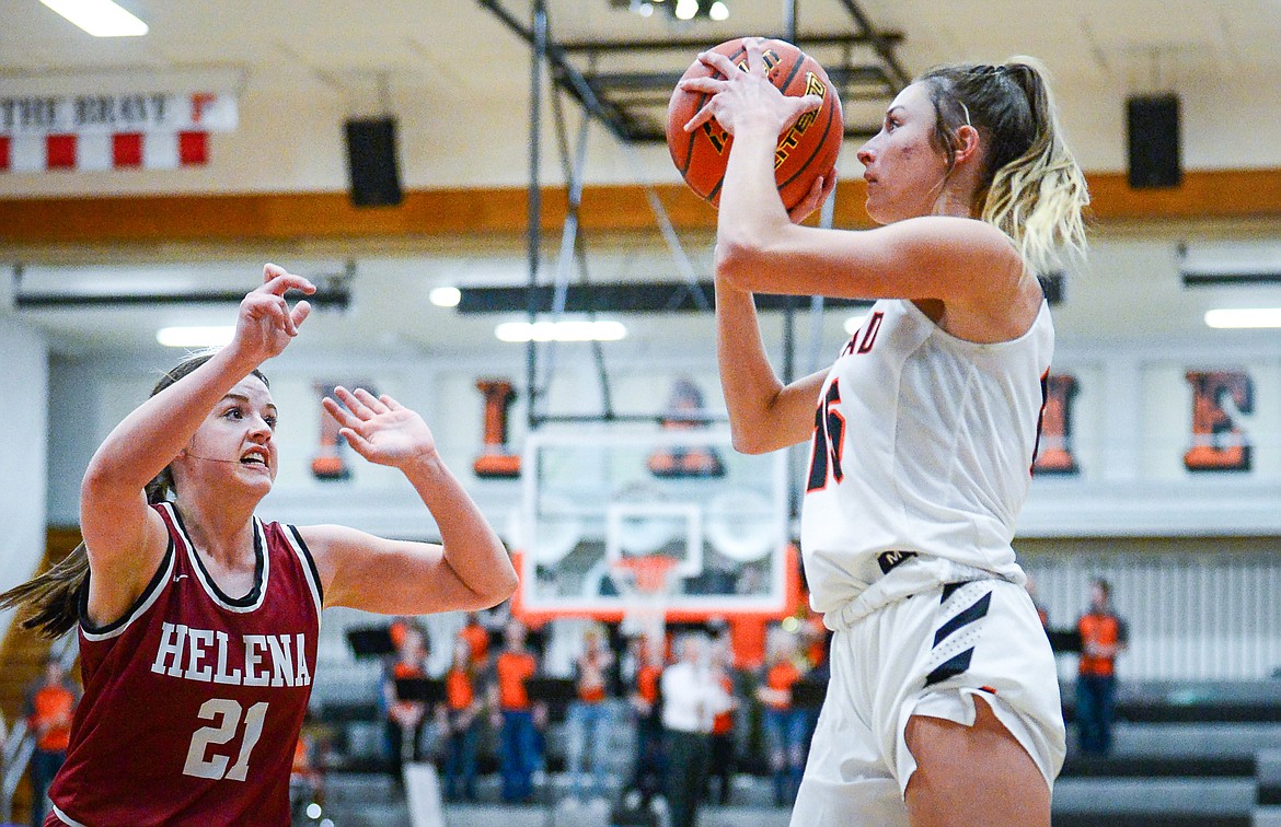 Flathead's Clare Converse (15) shoots over Helena High's Alex Bullock (21) at Flathead High School on Friday, Jan. 14. (Casey Kreider/Daily Inter Lake)