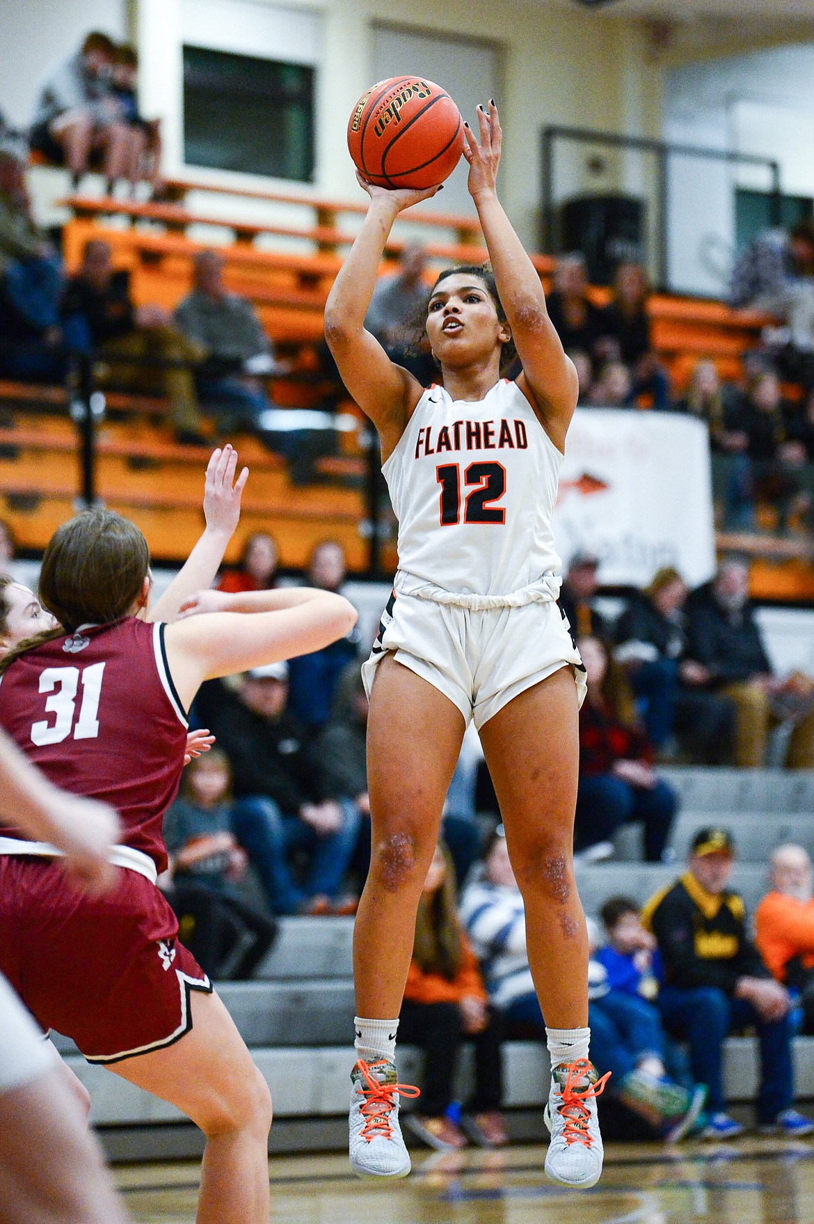 Flathead's Akilah Kubi (12) looks to shoot against Helena High at Flathead High School on Friday, Jan. 14. (Casey Kreider/Daily Inter Lake)