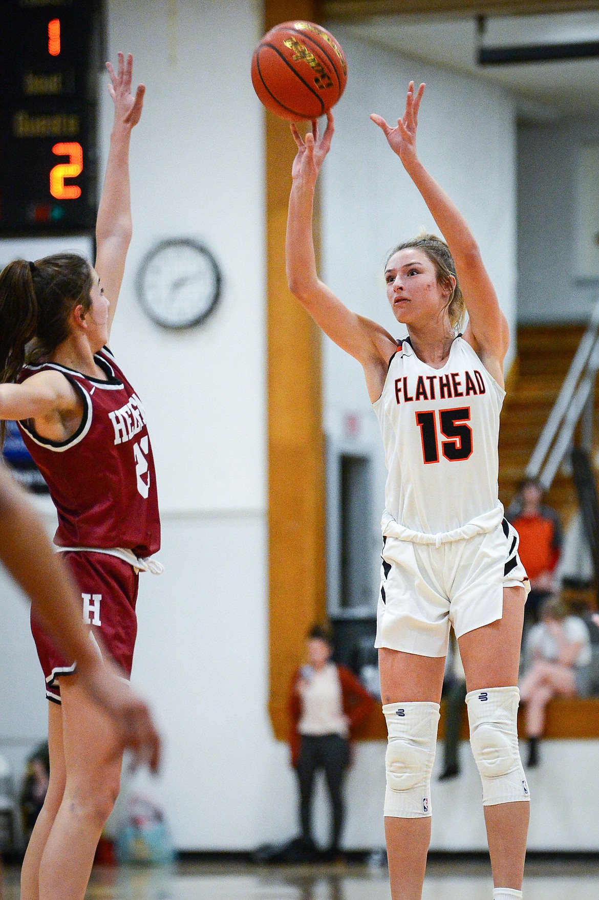 Flathead's Clare Converse (15) drains a three-pointer in the first quarter against Helena High at Flathead High School on Friday, Jan. 14. (Casey Kreider/Daily Inter Lake)