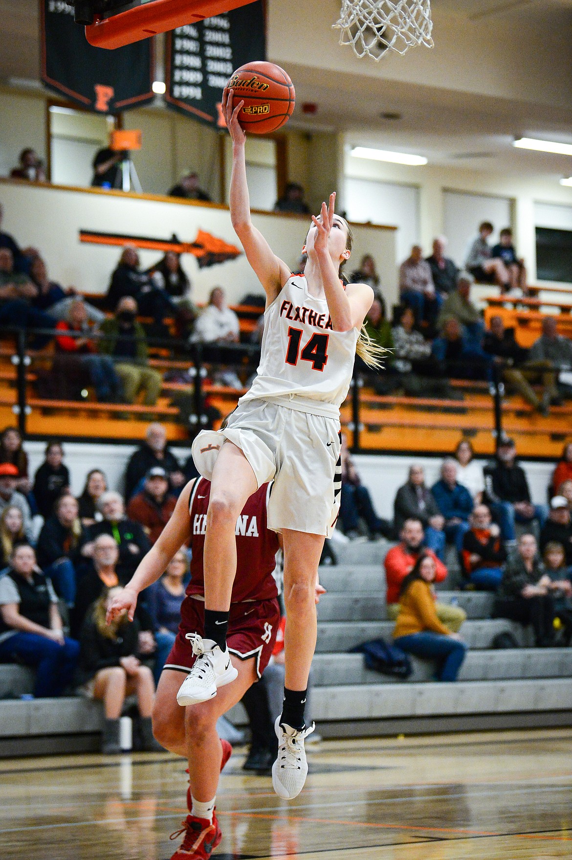 Flathead's Kennedy Moore (14) goes to the basket after coming up with a steal against Helena High at Flathead High School on Friday, Jan. 14. (Casey Kreider/Daily Inter Lake)