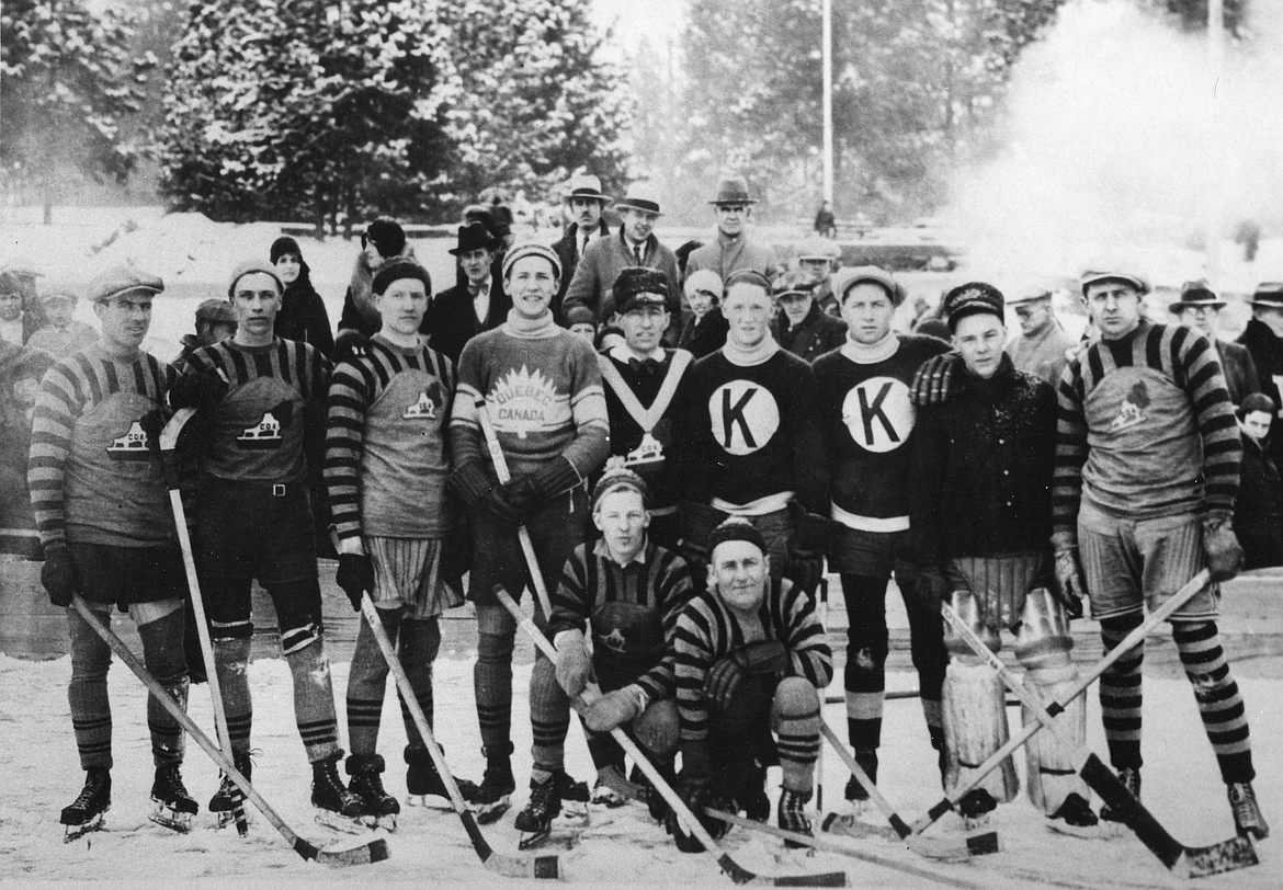 Coeur d'Alene Eskimos Ice Hockey Team (from left): Van Richardson, Glen Nylen, Gordon Reed, Ollie Gillette, Don McDonald, "K" on sweaters are from Kimberly, B.C., Harry Wilson, Earl Faulkner. Kneeling: Glen Gillett and Joe Whyte. First lady on left in back is Mrs. Joe Whyte.