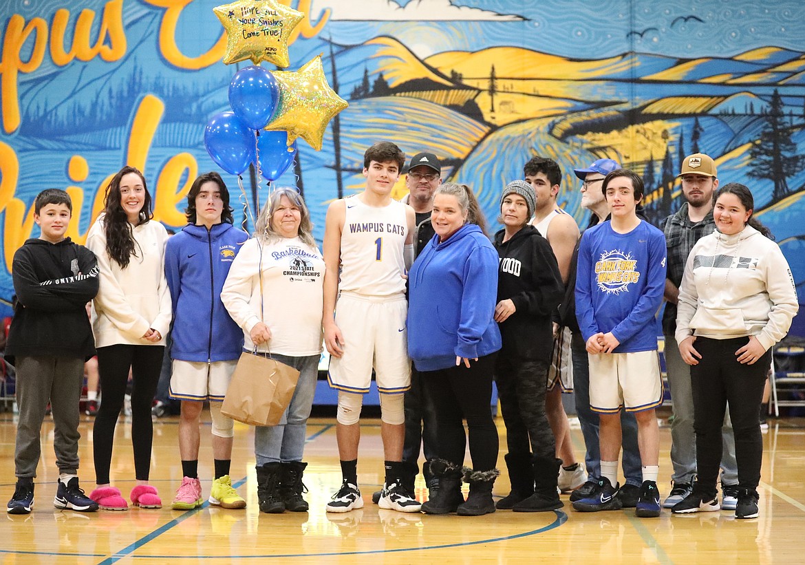 Carter Sanroman celebrates Senior Night with his family.