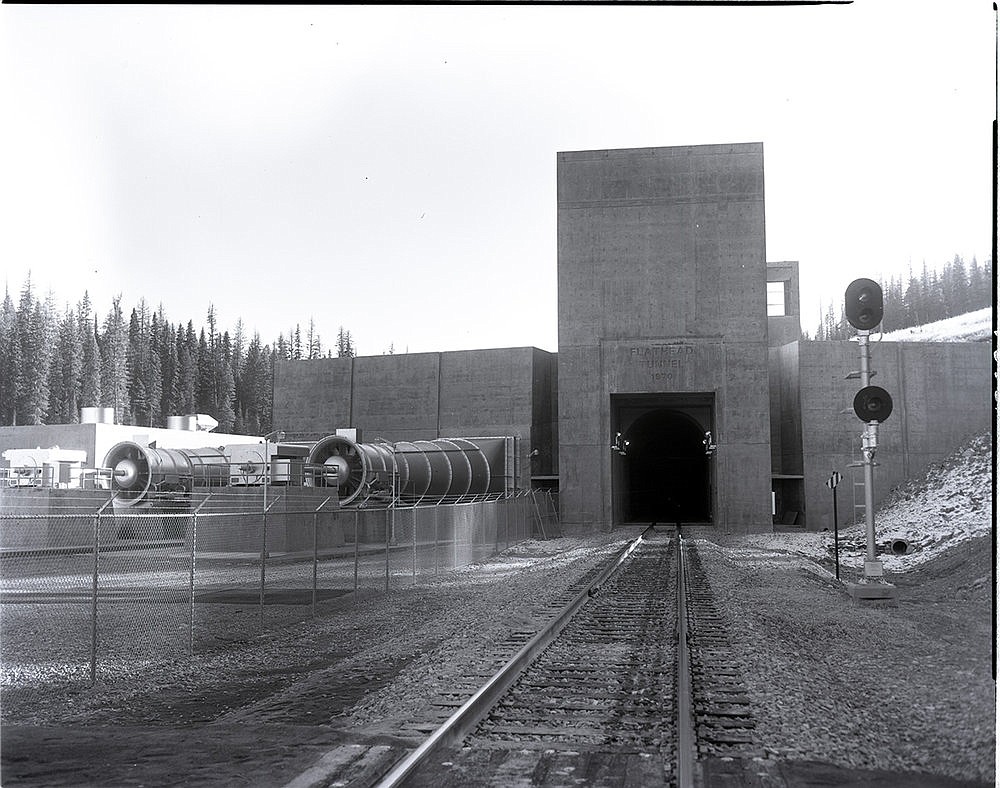 The completed north portal of the Flathead Tunnel near Trego. The fans for the tunnel's ventilation system can be seen on the left. (Mansfield Library, University of Montana)