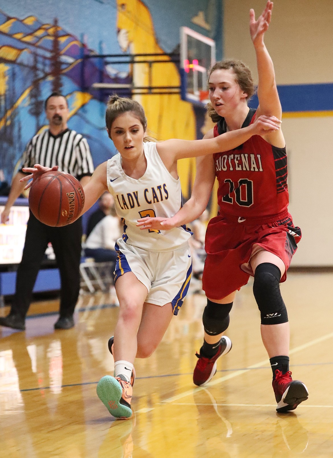 Paige Valliere drives toward the paint Friday.