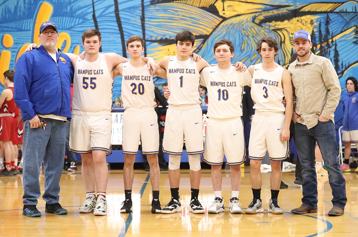 Clark Fork honored its five seniors prior to Friday's game. Pictured (from left): head coach Heath Beason, Zach Mueller, Sam Barnett, Carter Sanroman, Cole Reuter, Joe Bopp and assistant coach Stillman Berkley.