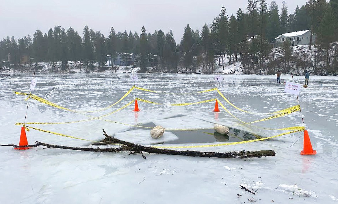 Photo courtesy Chris Larson
The hole in the ice at Lake Avondale after the Northern Lakes Fire District took additional steps with poles, yellow caution tape, buoys and signs to alert the public to it.