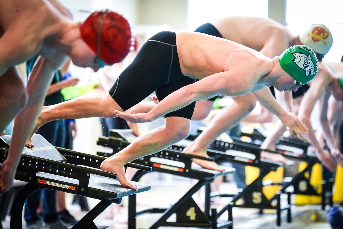 Glacier's Xander Stout leaps off the starting block at the start of the Men's 50 Yard Freestyle at the Kalispell Invite at The Summit on Saturday, Jan. 15. (Casey Kreider/Daily Inter Lake)