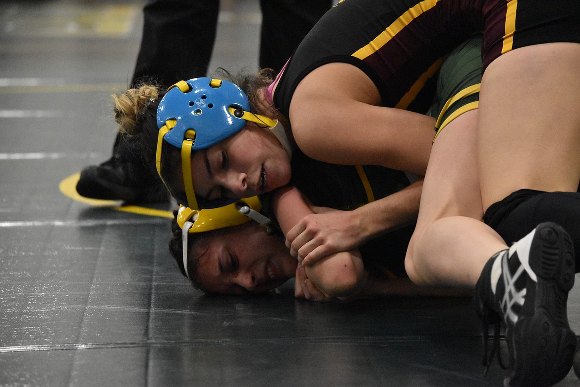 Richland High School’s Constance Fuentes is beaten by Moses Lake High School junior Brianna Martinez at the Quincy Bring Home Da Beef tournament Saturday.