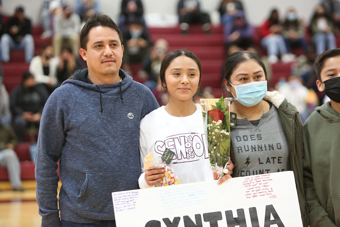 Wahluke High School senior Cynthia Moreno Diaz (center) with her dad Santos Moreno (left) and her mom Marisol Diaz on basketball Senior Night on Friday.