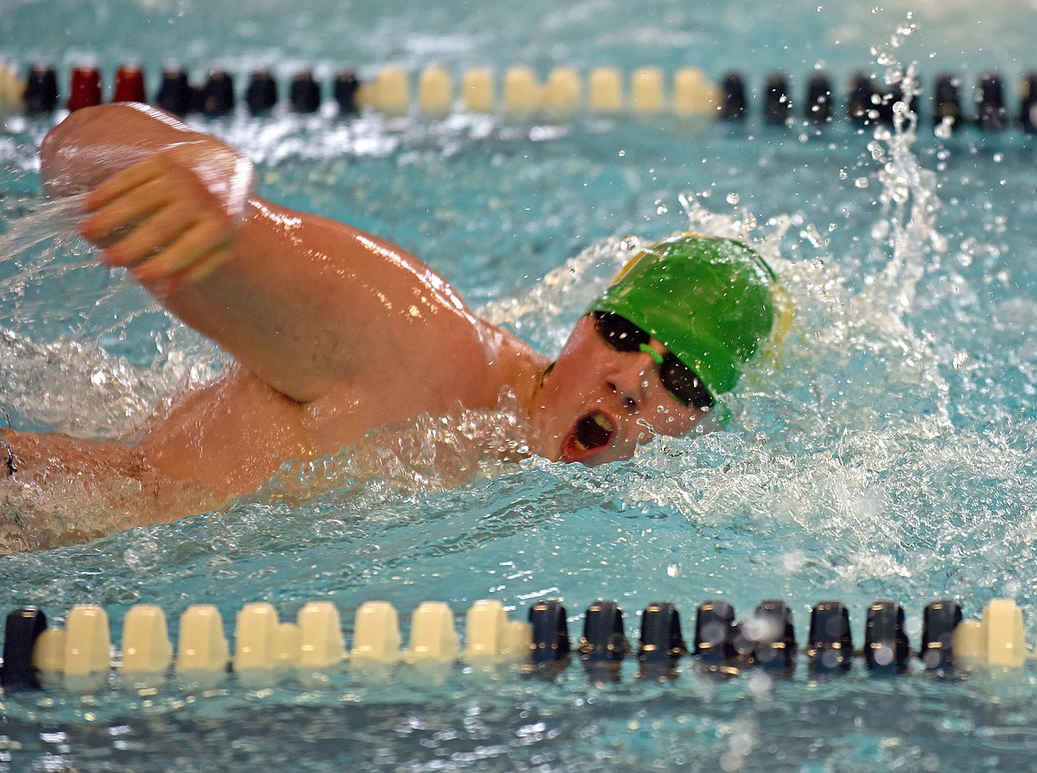 Whitefish senior Logan Niles swims in the 100 yard freestyle event at the Kalispell Invite on Saturday at The Summit. (Whitney England/Whitefish Pilot)