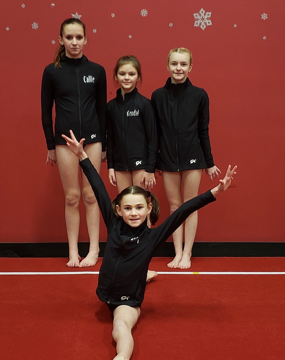 The Silver Valley Gymnastics Silver Team. Pictured are Callie Clark, Kendal Allen, Kora Foust, and in front is Ruby Brucick (in splits).