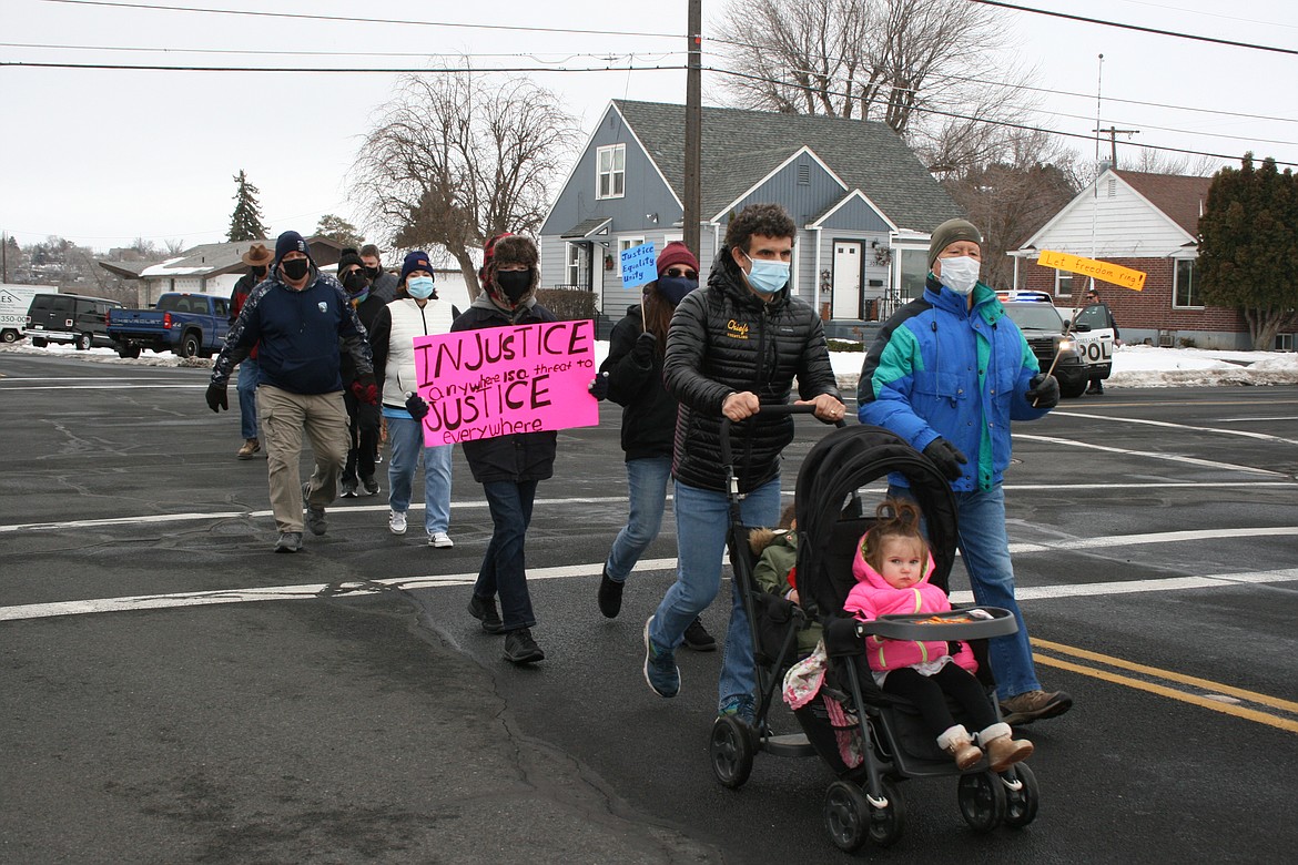 Marchers leave the Surf ‘n Slide Water Park parking lot in Moses Lake on a Martin Luther King Jr. Day march Monday to commemorate King’s legacy.